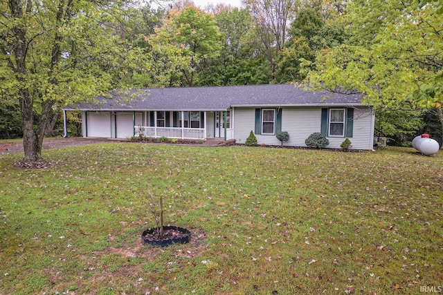 ranch-style home featuring covered porch, a garage, and a front lawn