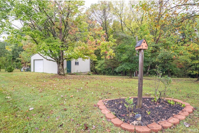 view of yard featuring a garage and an outdoor structure