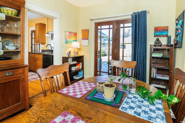 dining area featuring french doors and sink