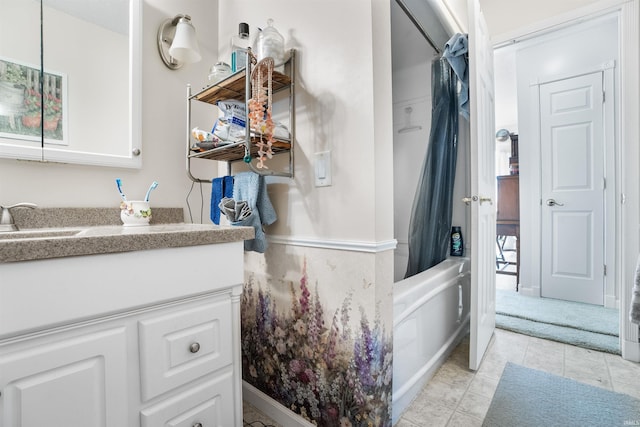 bathroom featuring vanity and shower / bathtub combination with curtain