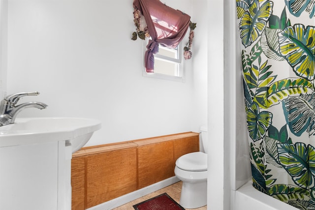 full bathroom with toilet, vanity, shower / tub combo with curtain, and tile patterned floors