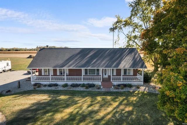 view of front of property with a porch and a front yard