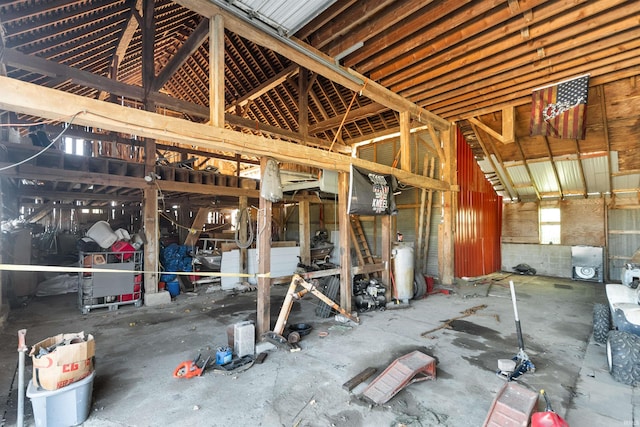 miscellaneous room with a towering ceiling