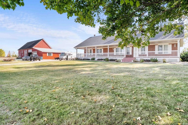 view of front of home with a front yard and a porch