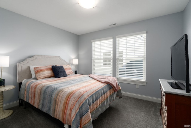 bedroom featuring dark colored carpet