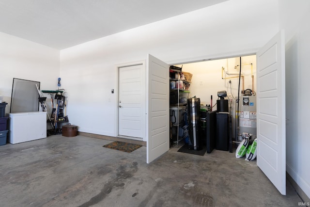 garage with fridge and gas water heater