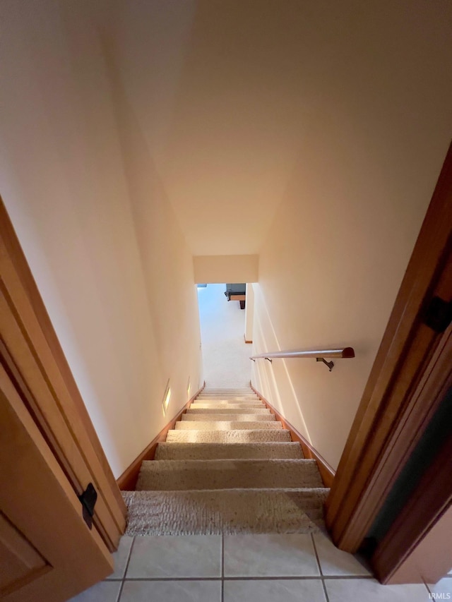 stairs with tile patterned floors