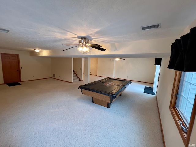 playroom featuring light carpet, ceiling fan, a textured ceiling, and pool table