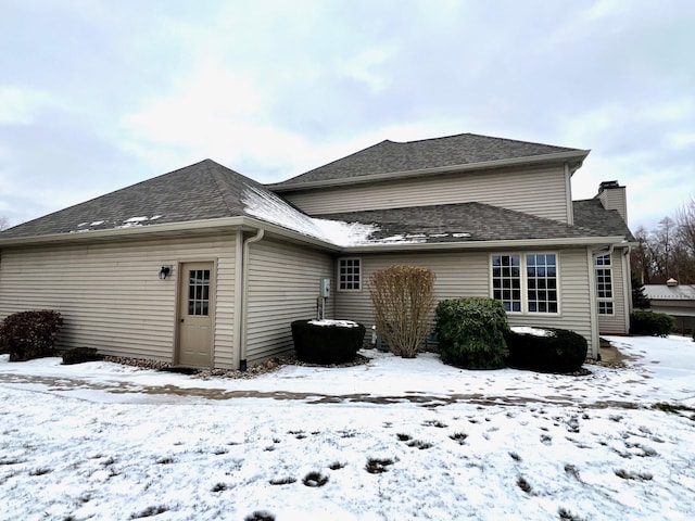 view of snow covered house