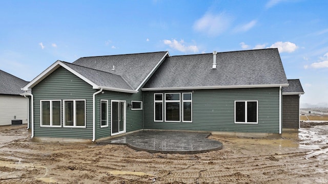 rear view of property featuring a patio area