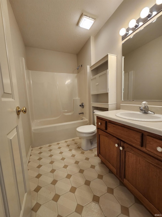 full bathroom featuring a textured ceiling, toilet, vanity, and bathing tub / shower combination