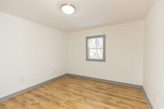 spare room featuring hardwood / wood-style flooring