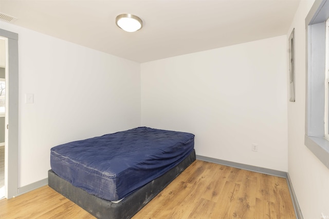 bedroom with light hardwood / wood-style flooring