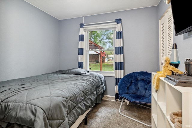 carpeted bedroom featuring multiple windows