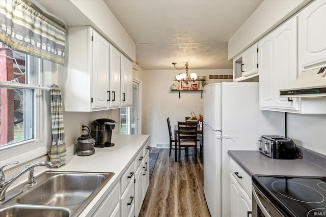 kitchen featuring white cabinetry, sink, dark hardwood / wood-style floors, a notable chandelier, and stainless steel electric range