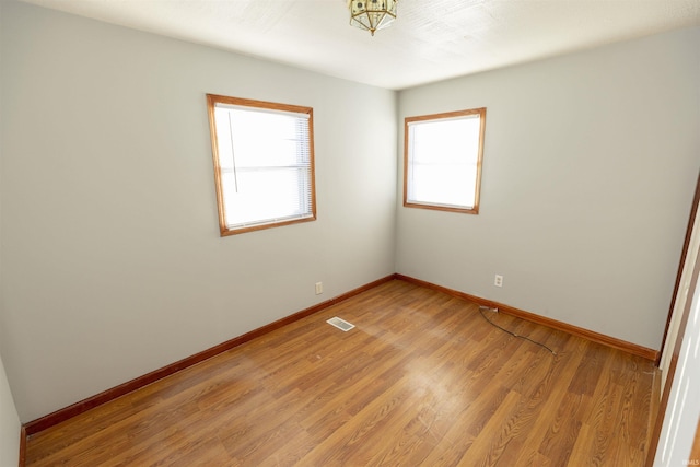 unfurnished room featuring light hardwood / wood-style flooring