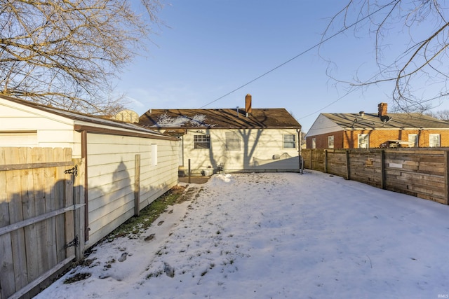 view of snow covered house