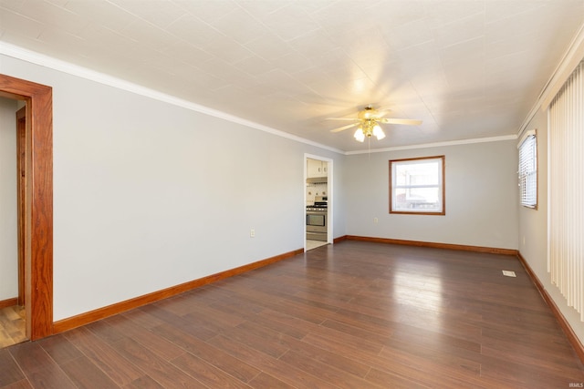 unfurnished room featuring dark wood-type flooring, crown molding, and ceiling fan