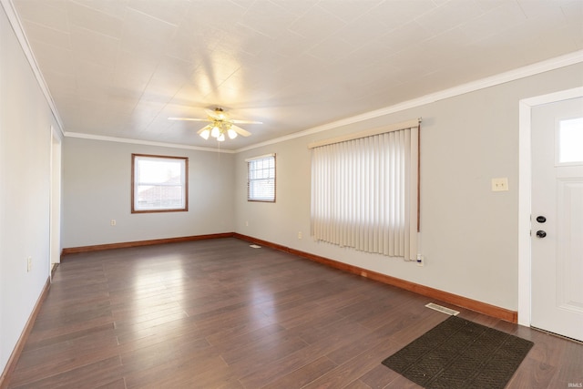 foyer entrance with ceiling fan, crown molding, and dark hardwood / wood-style floors