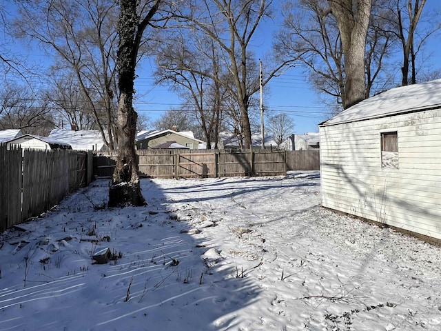 view of yard layered in snow