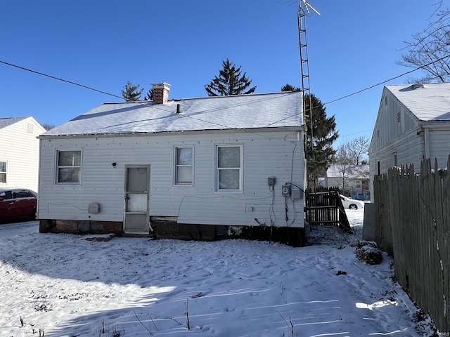 view of snow covered house