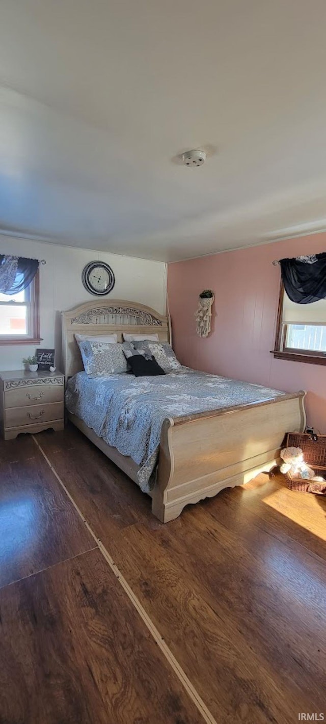 unfurnished bedroom featuring dark hardwood / wood-style floors