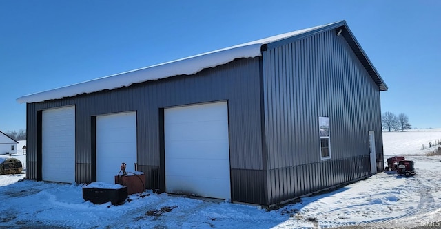 view of snow covered garage