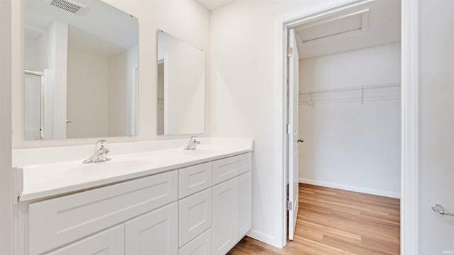 bathroom featuring wood-type flooring and vanity