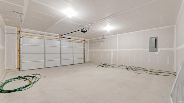 garage with electric panel and a garage door opener