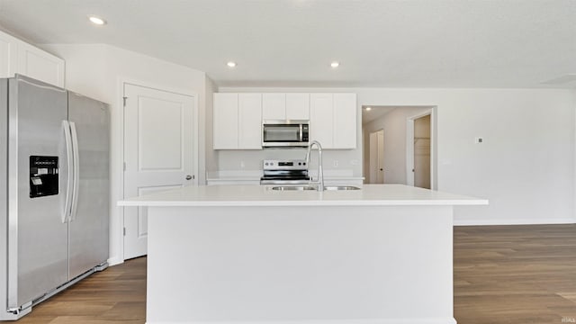 kitchen featuring sink, white cabinetry, stainless steel appliances, and a kitchen island with sink