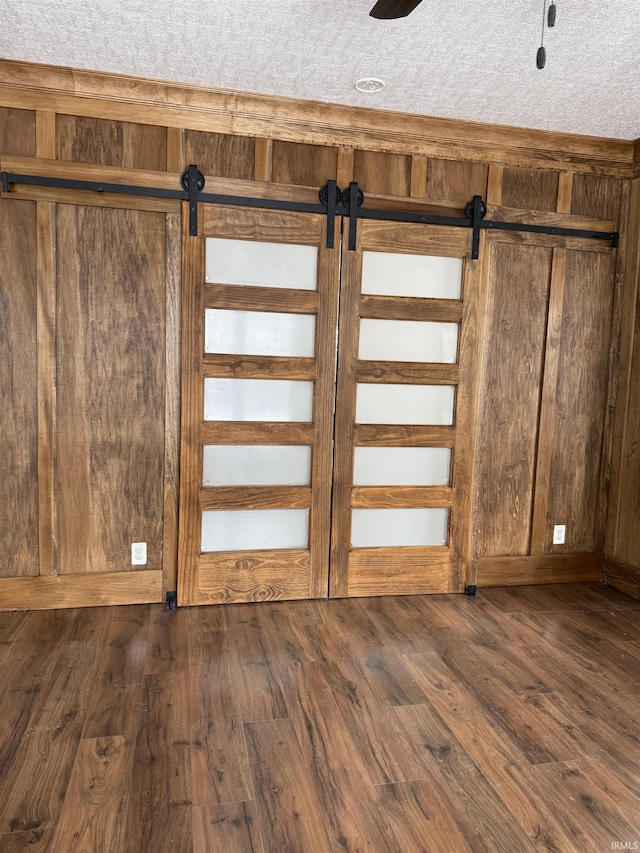 interior details with wood walls and hardwood / wood-style floors