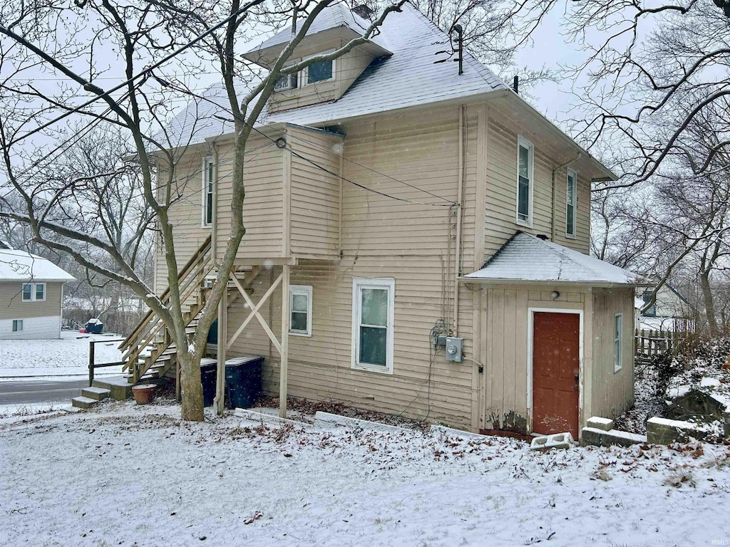 view of snow covered property