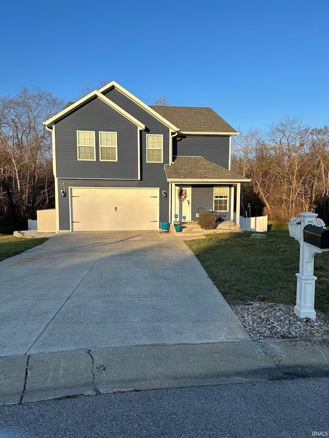 front facade featuring a garage and a front yard