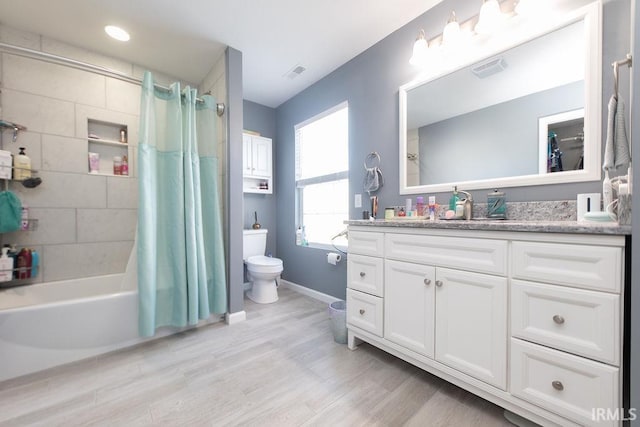 full bathroom with toilet, vanity, wood-type flooring, and shower / tub combo with curtain