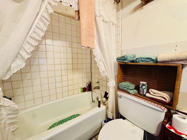 bathroom with toilet and shower / bath combo with shower curtain