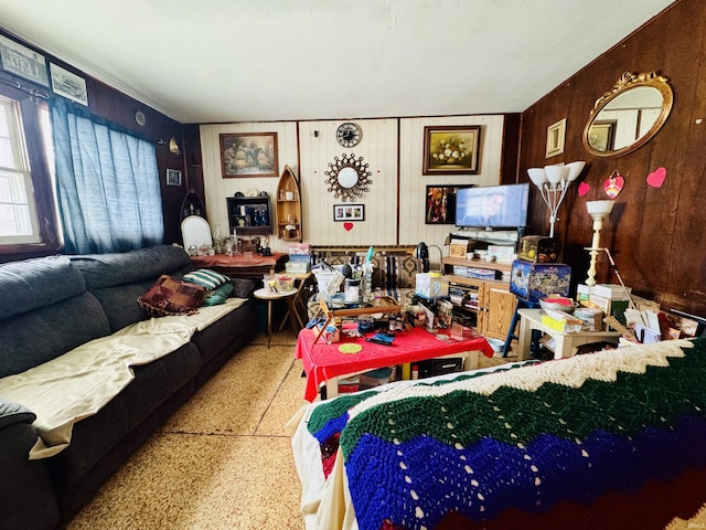 living room with wood walls