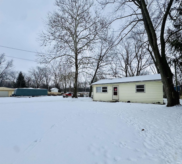 view of yard covered in snow