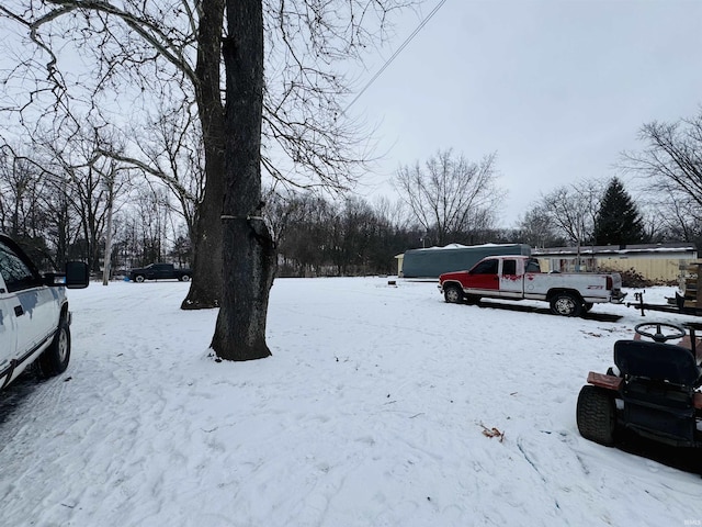 view of yard layered in snow