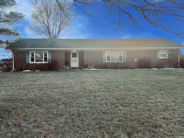 ranch-style home with a front lawn