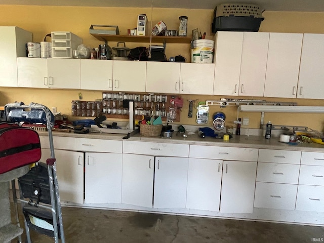 kitchen featuring white cabinetry