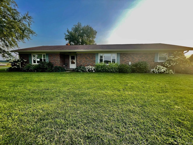 ranch-style house with a front lawn