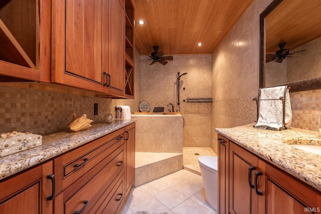 bathroom with toilet, ceiling fan, tile patterned flooring, and vanity