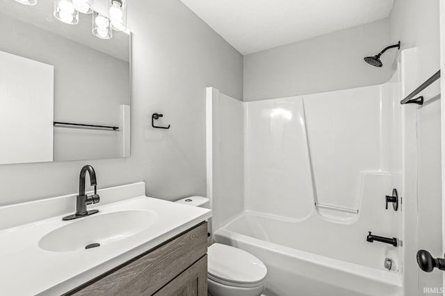 full bathroom featuring toilet, vanity, shower / bathtub combination, and a textured ceiling