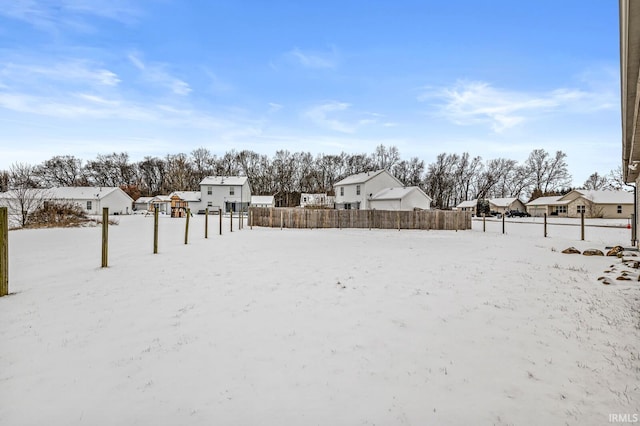 view of yard layered in snow