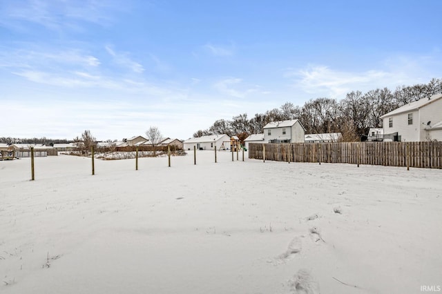 view of yard layered in snow