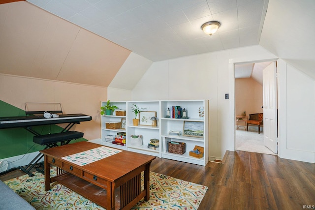 playroom with vaulted ceiling and dark hardwood / wood-style flooring