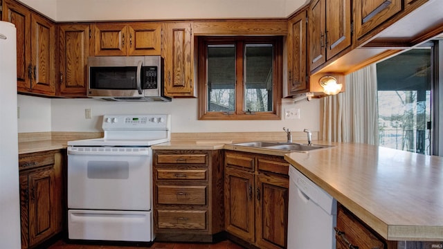 kitchen featuring sink and white appliances