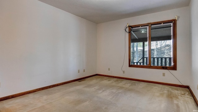 view of carpeted spare room