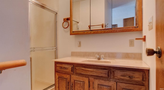 bathroom with an enclosed shower and vanity