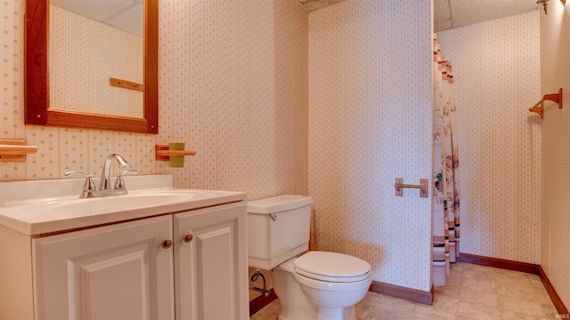 bathroom featuring toilet and vanity